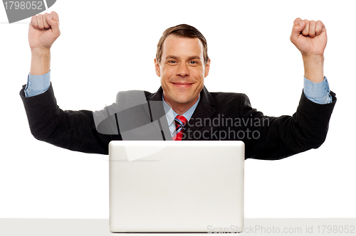 Image of Excited businessman celebrating success