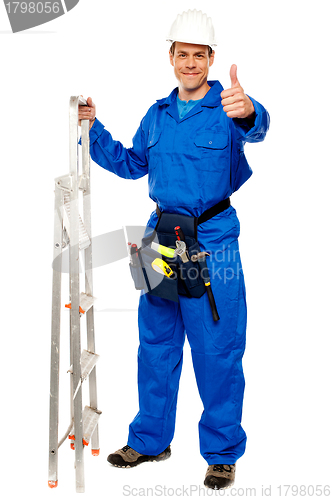 Image of Repairman holding ladder and showing thumbs up