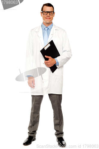 Image of Full length shot of doctor posing with clipboard