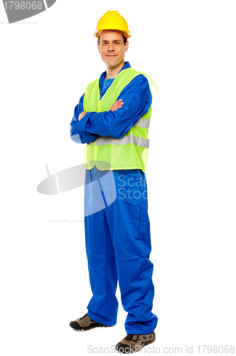 Image of Handsome male repairman posing in style