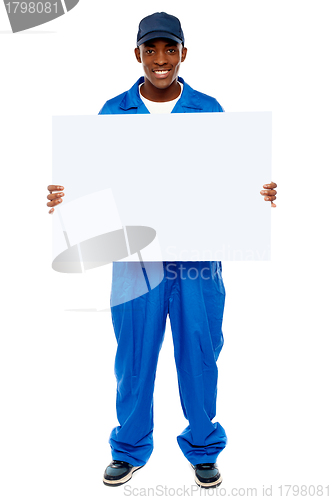 Image of Courier guy presenting blank white billboard