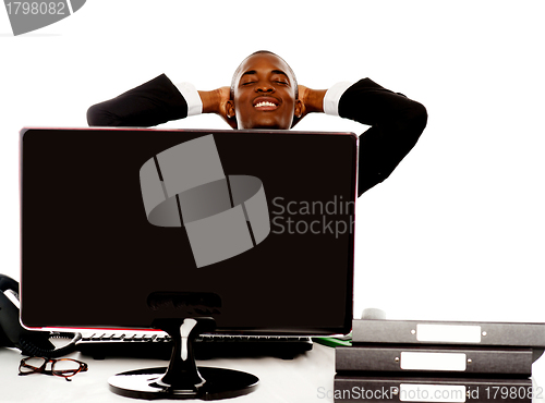Image of Young african businessman relaxing