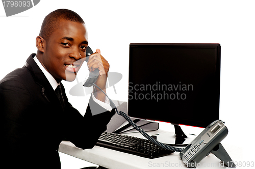 Image of African businessman attending phone call