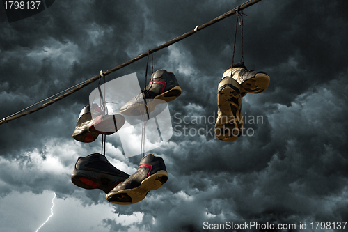 Image of Sneakers Hanging on a Telephone Line