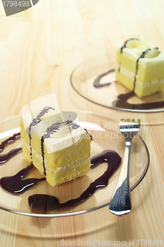 Image of fresh cream cake closeup with chocolate sauce