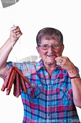 Image of female butcher with smoked sausage