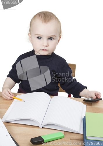 Image of young child at writing desk