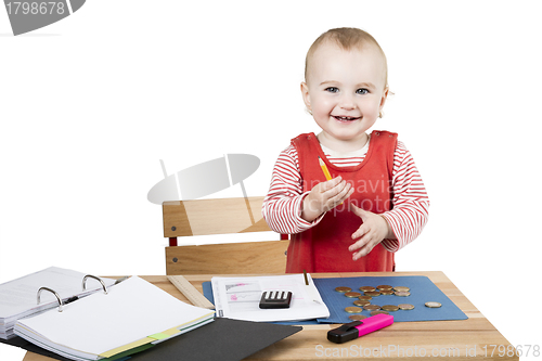 Image of young child at writing desk