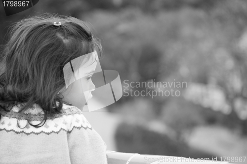 Image of Portrait of small cute girl looking to side with copy space 