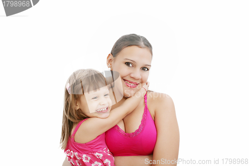 Image of Portrait of Hispanic pregnant woman with daughter isolated over 
