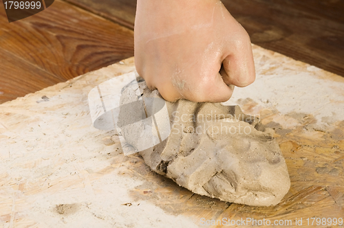 Image of Child hands of a potter