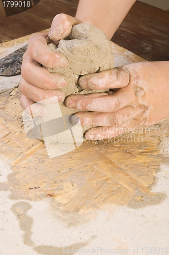 Image of Child hands of a potter