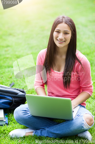 Image of Hispanic college student with laptop