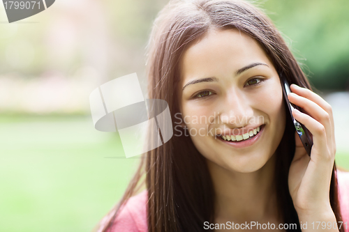 Image of Hispanic college student on the phone