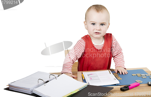 Image of young child at writing desk