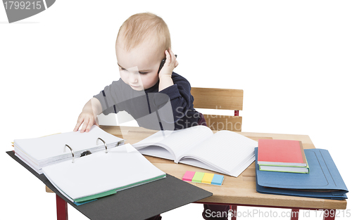 Image of young child at writing desk