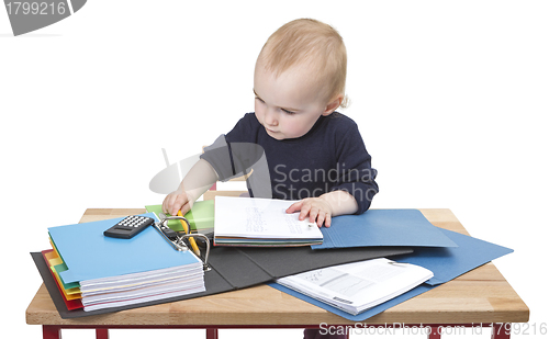 Image of young child at writing desk