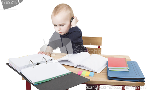 Image of young child at writing desk