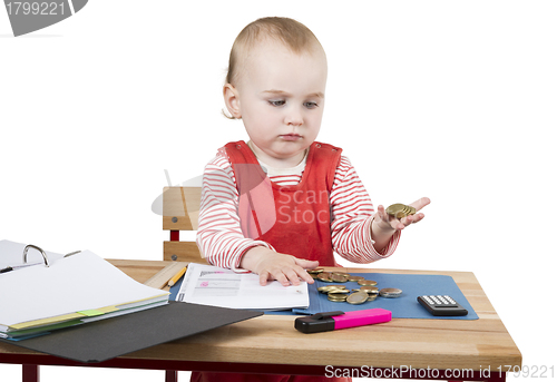 Image of young child at writing desk