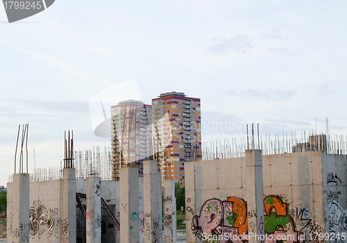 Image of Unfinished building painted graffiti skyscrapers 