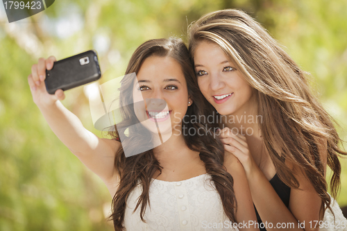 Image of Attractive Mixed Race Girlfriends Taking Self Portrait with Came