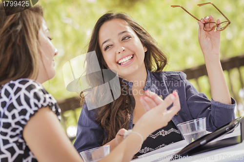 Image of Mixed Race Girls Working on Electronic Devices