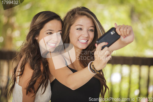 Image of Attractive Mixed Race Girlfriends Taking Self Portrait with Came