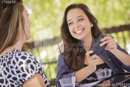 Image of Mixed Race Girls Working on Electronic Devices