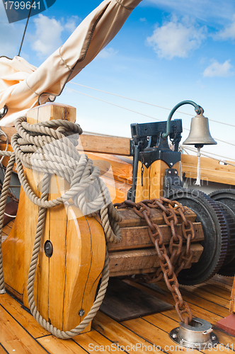 Image of ship's Bell and anchor lifting mechanism on an old sailboat