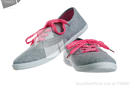 Image of Beautiful female pink sneakers, it is isolated on white