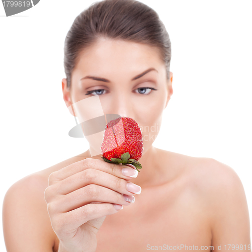 Image of woman holding strawberry