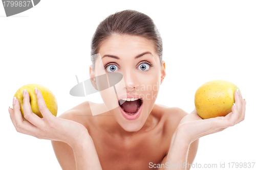 Image of Surprised woman holding two apples