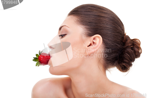 Image of  sexy woman with strawberry in mouth