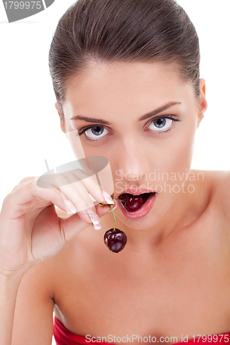Image of  woman eating cherry