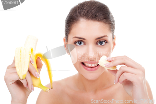 Image of woman eating banana and smiling