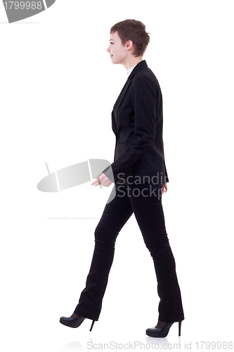 Image of young business woman is walking