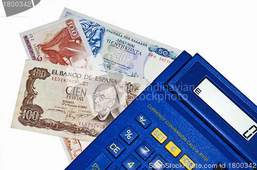 Image of Euro-crisis,calculator with Peseta and Drachm banknotes