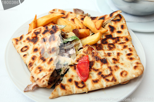 Image of Covered pita pie and fries