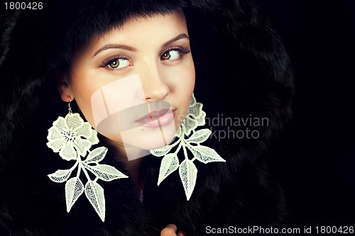 Image of Glamour young woman wearing fur hat