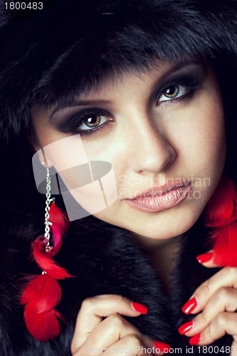 Image of Glamour young woman wearing fur hat