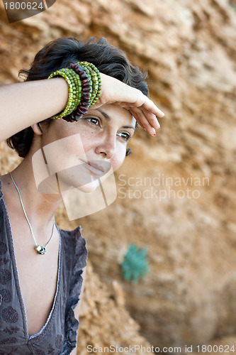 Image of woman among rocks