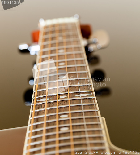 Image of View down the fretboard of guitar