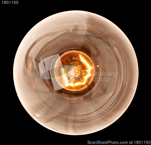 Image of Incandescent light bulb lit from above