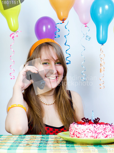 Image of Birthday. Happy pretty girl with phone
