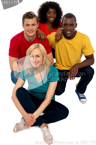 Image of Group of friends sitting on floor