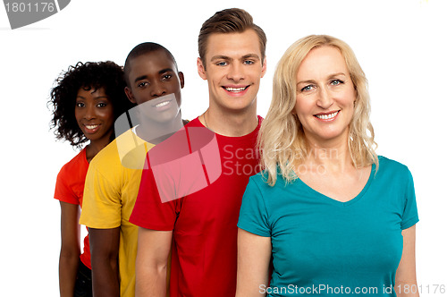 Image of Group of cheerful teenagers standing in a line