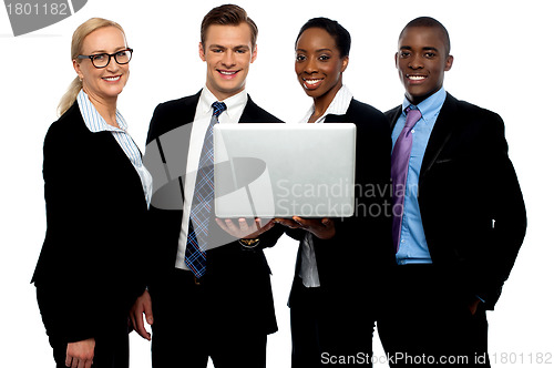 Image of Business colleagues watching video on laptop