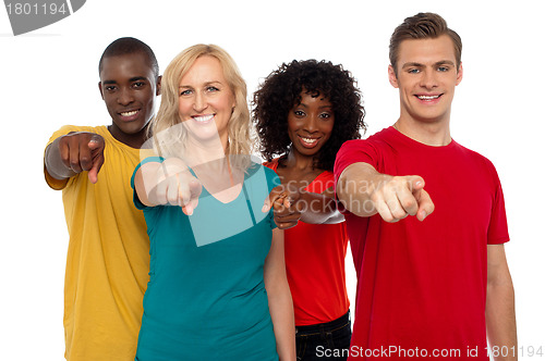 Image of Team of smiling teenagers indicating at you