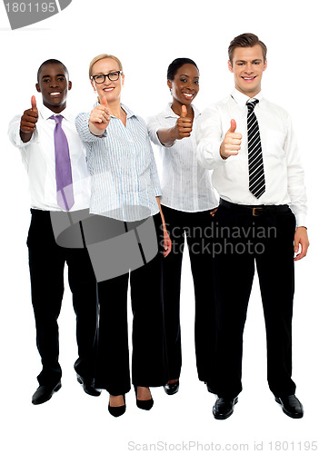 Image of Full length shot executives showing thumbs up