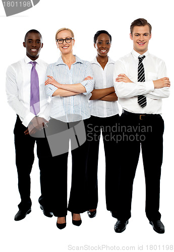 Image of Young attractive business people. Arms folded